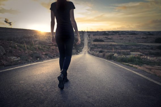 woman walks road alone needing cigna rehab coverage