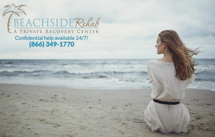 woman sitting on beach