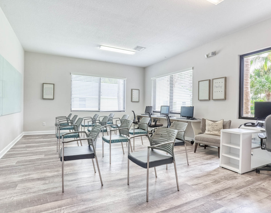 woman reads book at best luxury rehab in florida