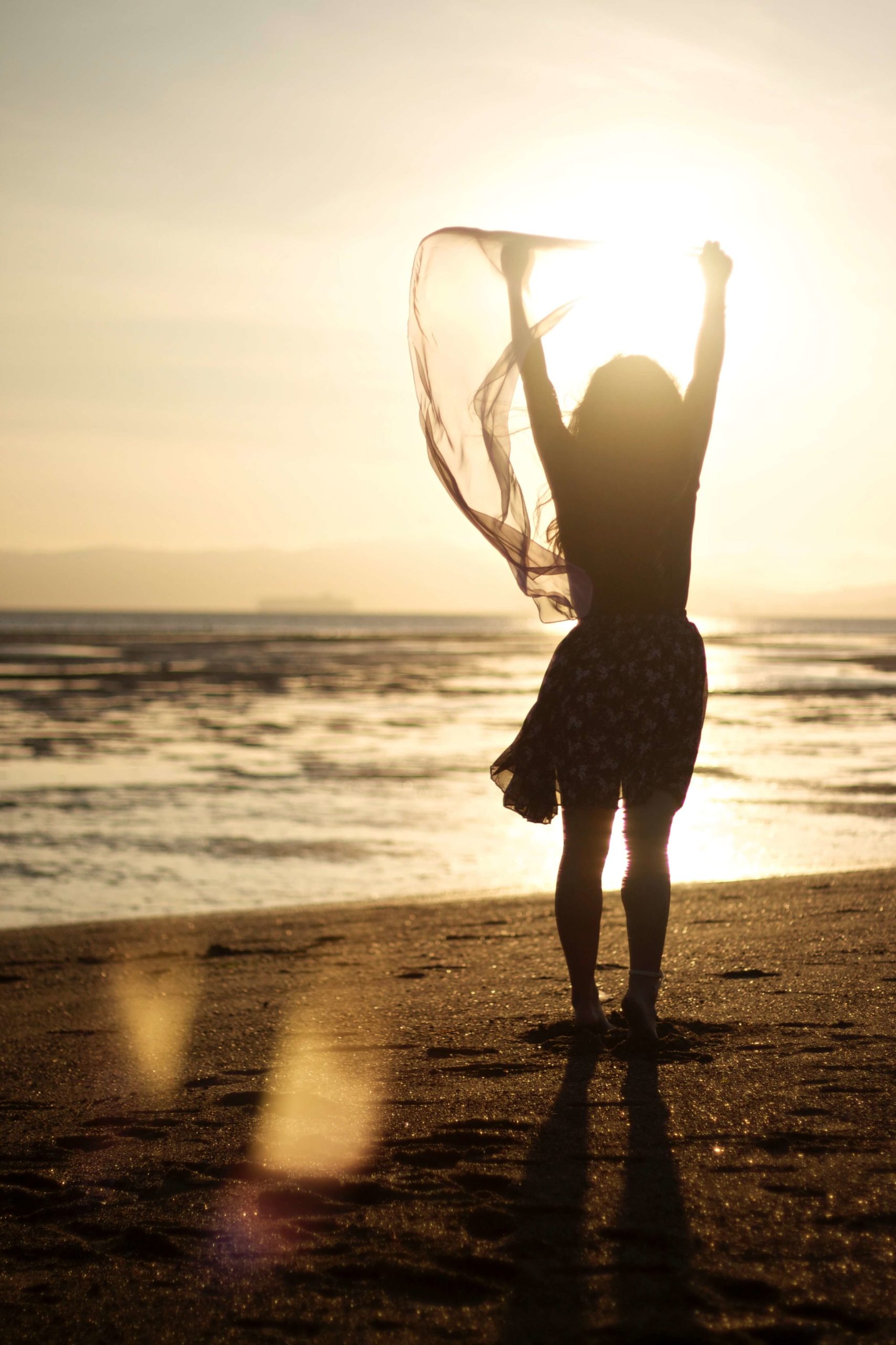 woman going through codependency recovery on the beach