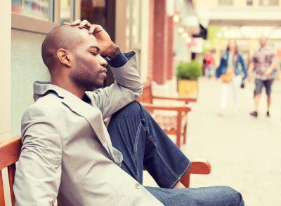  man contemplating on bench 