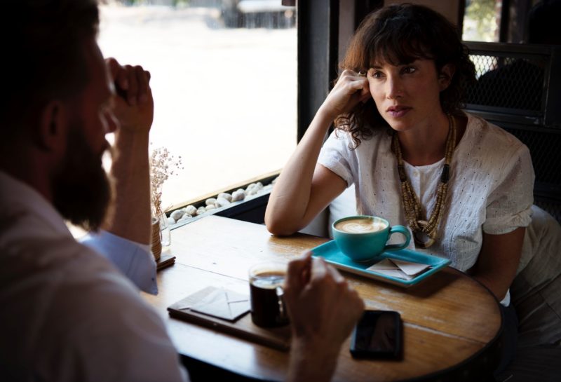 man and woman having a serious conversation