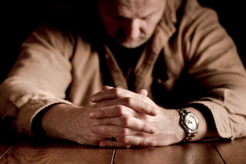 man contemplating entering roxycodone treatment center in Florida