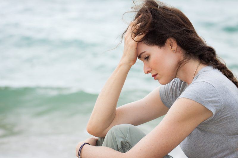 woman contemplating leaving a rehab center early