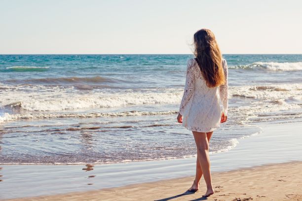 young woman thinking on beach